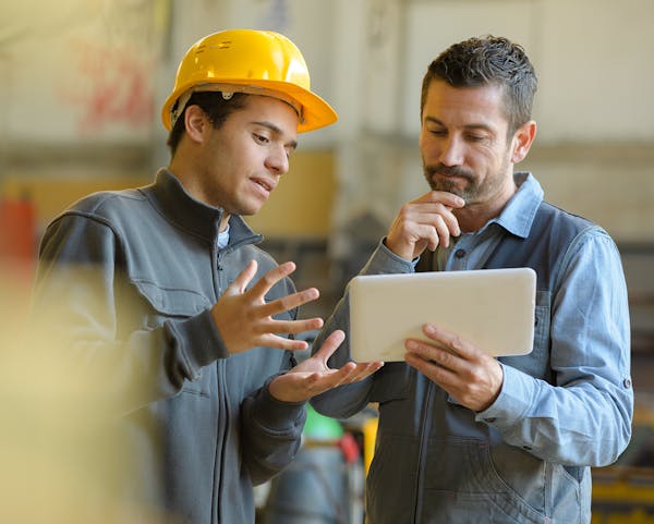 Managers reviewing asset tracking data